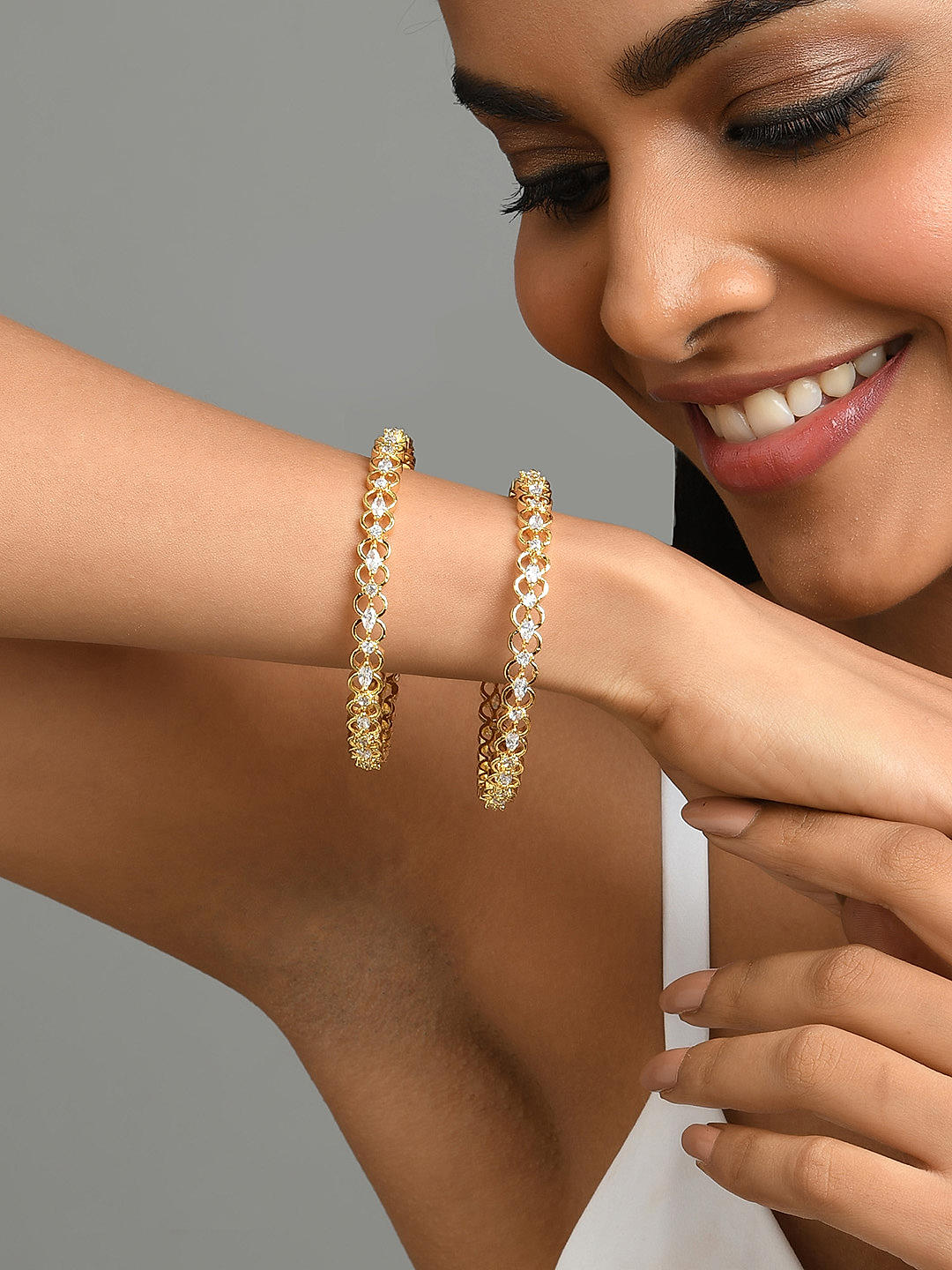 Gold plated american diamond bangles on sale