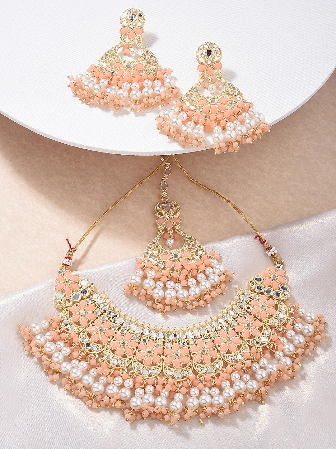 Peach necklace and earrings top