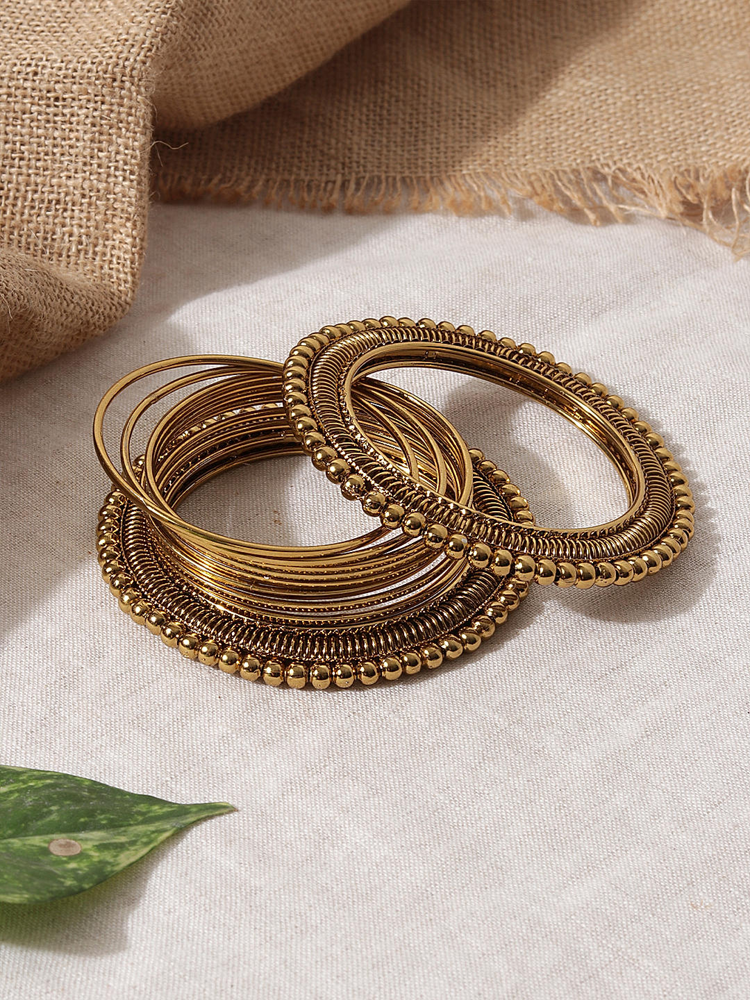 Gold metal bangles set hotsell