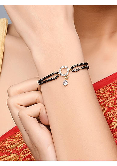 Fida Luxurious Gold Plated American Diamond Stones & Black Beads Bracelet For Women