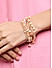 Toniq Gold Plated Peach beaded Set of 7 Elasticized Bracelet for Women