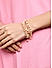 Toniq Gold Plated Peach beaded Set of 7 Elasticized Bracelet for Women