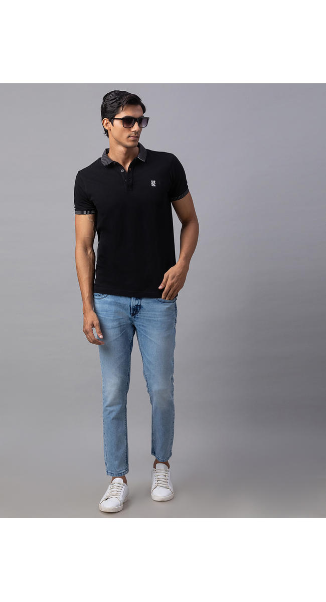 black polo with light blue jeans