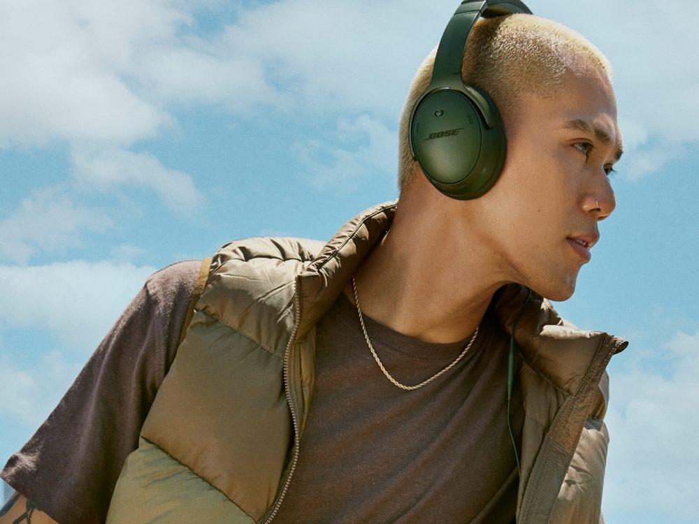 Man wearing Bose QuietComfort Headphones outside