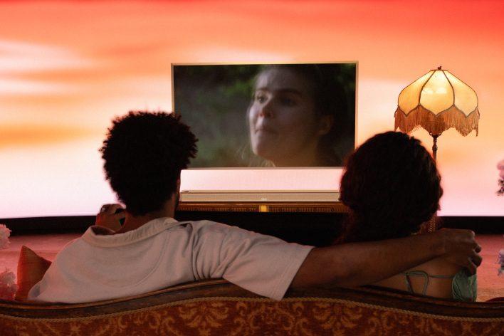 A couple watching TV with a Bose Smart Ultra Soundbar